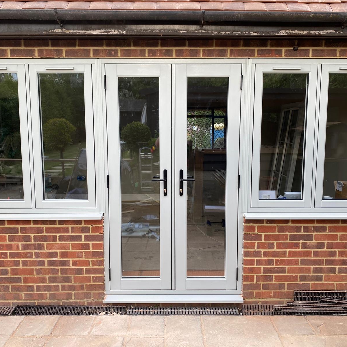 Heritage-style Residence 7 window installation with Painswick exterior and white interior in Guildford
